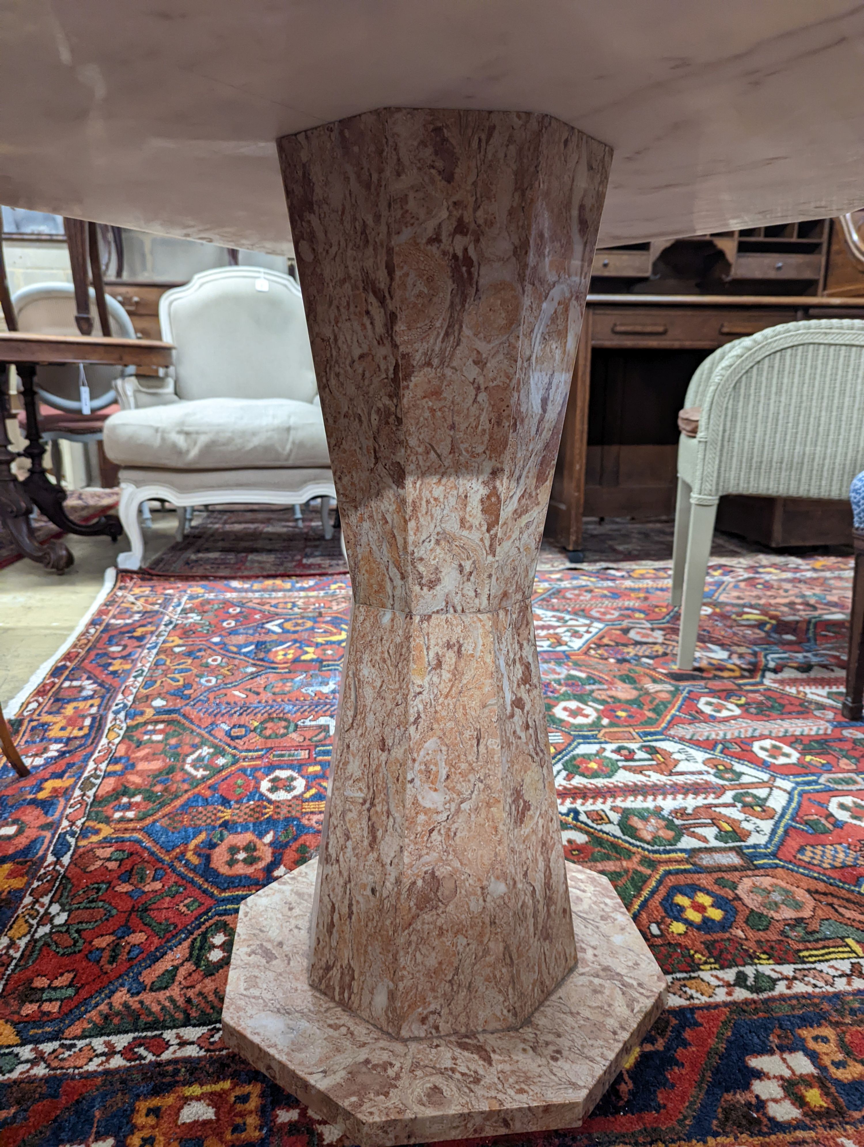 A modern octagonal specimen marble games table, width 91cm, depth 78cm